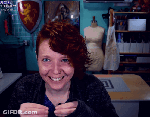 Woman Smiling At Shield Saying UB X79 GIF