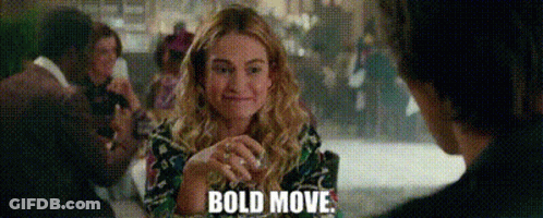 Woman Smiling At Table While Man Says Bold Move GIF