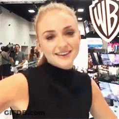 Woman Smiling At WB Sign GIF