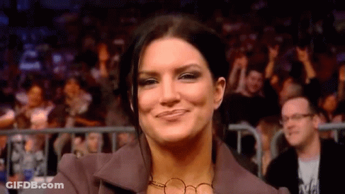 Woman Smiling At Wrestling Event GIF