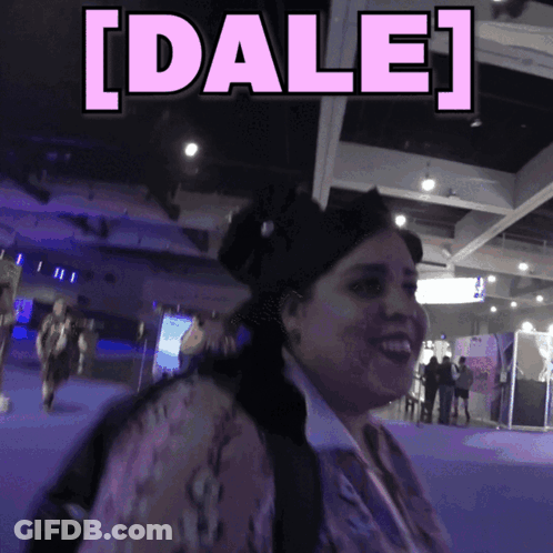 Woman Smiling Beside Sign Saying Dale GIF