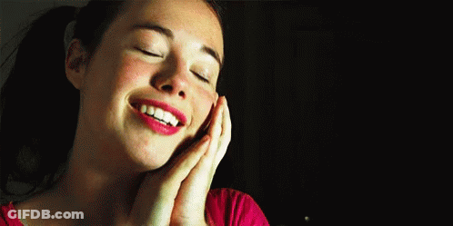 Woman Smiling Eyes Closed Hands On Face GIF