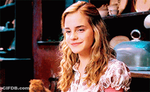 Woman Smiling Holding Cat In Lap GIF