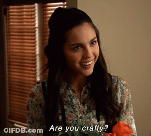Woman Smiling Holding Flower Saying You Crafty GIF