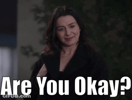 Woman Smiling Holding Paper Saying Are You Okay GIF