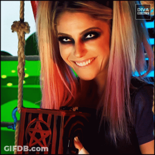 Woman Smiling Holding Pentagram Box In Front Of Diva Banner GIF
