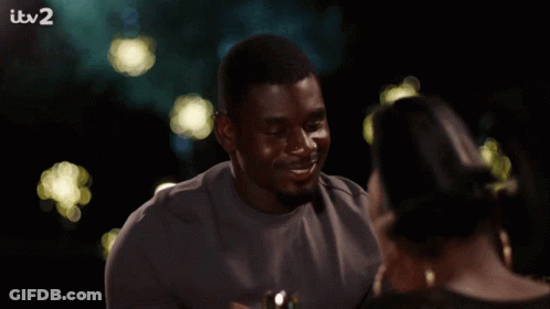 Woman Smiling Holding Wine Glass At ITV2 TV GIF