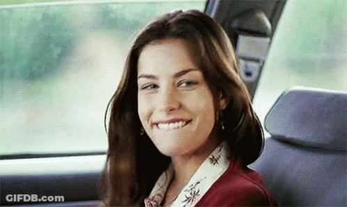 Woman Smiling In Back Seat Of Car GIF