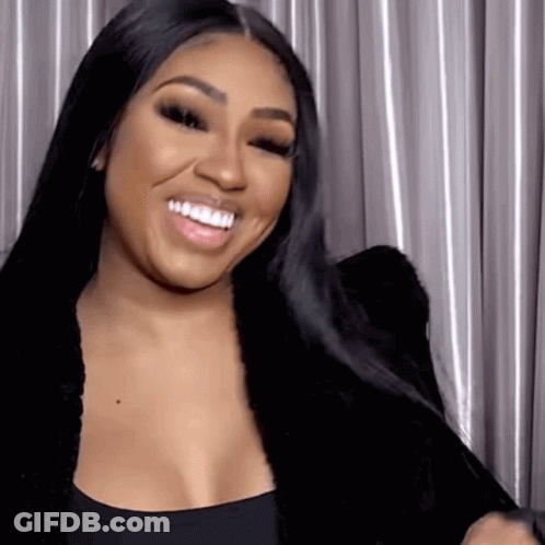 Woman Smiling In Black Top And Jacket GIF