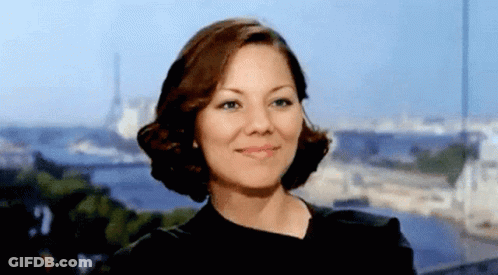 Woman Smiling In Black Top GIF