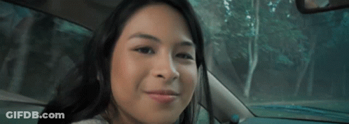 Woman Smiling In Car With Trees GIF