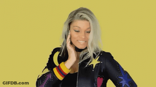 Woman Smiling In Colorful Star And Heart Jacket GIF