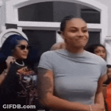 Woman Smiling In Crowd GIF