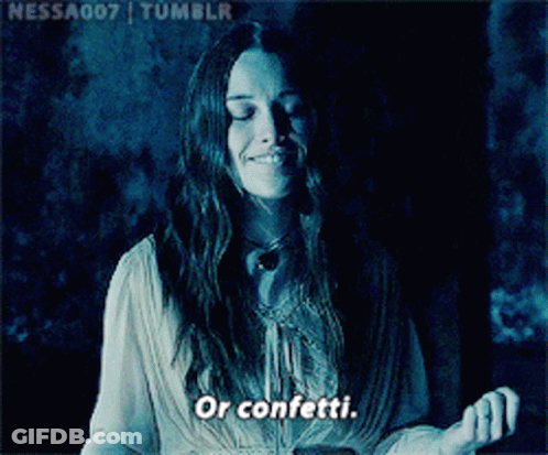 Woman Smiling In Dark Room Saying Confetti GIF