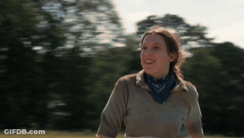 Woman Smiling In Field With Bandana GIF
