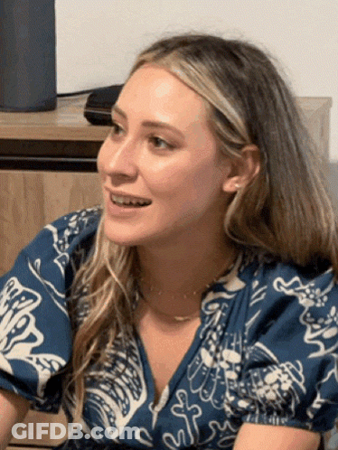 Woman Smiling In Floral Blue And White Shirt GIF