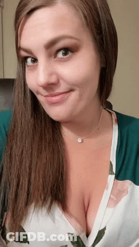 Woman Smiling In Floral Shirt And Necklace GIF