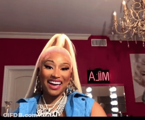Woman Smiling In Front Of AJM Sign GIF