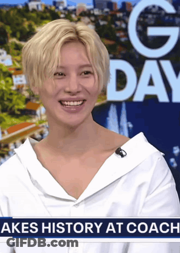 Woman Smiling In Front Of Akes History At Coach Sign GIF