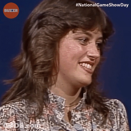Woman Smiling In Front Of Blue Background Buzzr Logo GIF