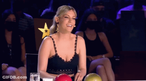 Woman Smiling In Front Of Bowling Ball GIF