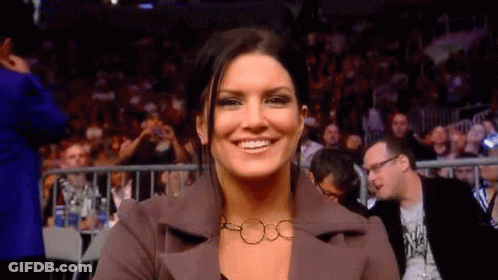 Woman Smiling In Front Of Crowd GIF