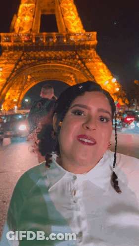 Woman Smiling In Front Of Eiffel Tower GIF