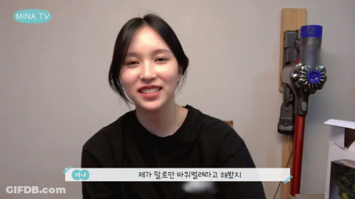 Woman Smiling In Front Of Mina TV Vacuum GIF
