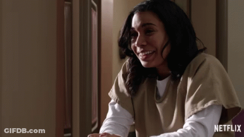 Woman Smiling In Front Of Netflix Ad GIF