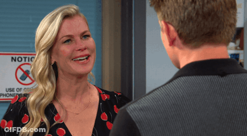 Woman Smiling In Front Of Notice Sign GIF