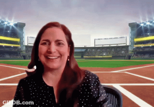 Woman Smiling In Front Of Oakland Baseball Field GIF