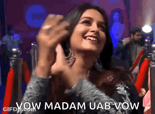 Woman Smiling In Front Of Red Carpet Saying Vow Madam Uab Vow GIF