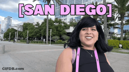 Woman Smiling In Front Of San Diego Sign GIF