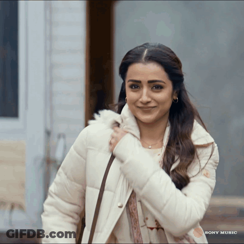 Woman Smiling In Front Of Sony Music Ad GIF