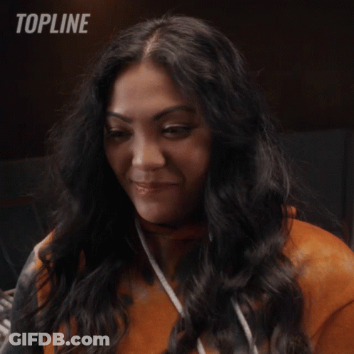 Woman Smiling In Front Of Topline Logo GIF