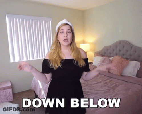 Woman Smiling In Front Of TV Saying Play GIF