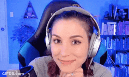 Woman Smiling In Headphones At Microphone GIF