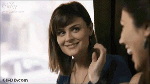 Woman Smiling In Mirror With Another Woman GIF