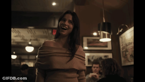 Woman Smiling In Off Shoulder Sweater GIF