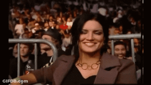 Woman Smiling In Stadium Crowd GIF
