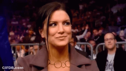 Woman Smiling In Stadium Crowd GIF