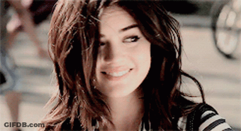 Woman Smiling In Striped Shirt GIF