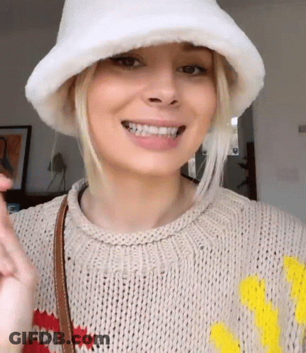 Woman Smiling In Sweater And White Hat GIF