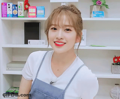 Woman Smiling In White Shirt And Blue Overalls GIF