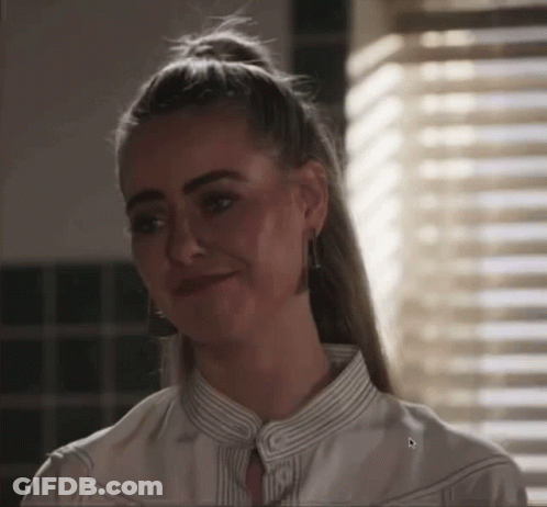 Woman Smiling In White Striped Shirt GIF