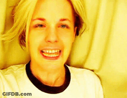 Woman Smiling In White T-Shirt And Black Collar GIF