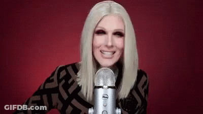 Woman Smiling Into Microphone GIF