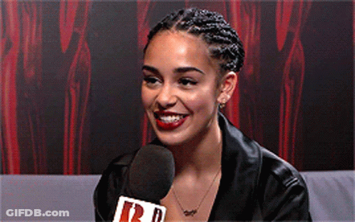 Woman Smiling Into Microphone Saying R GIF