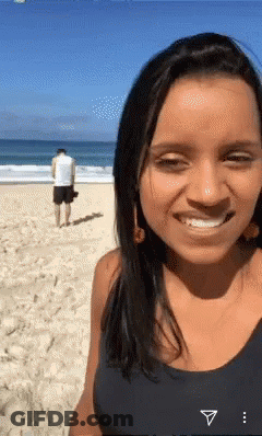 Woman Smiling Man Behind GIF