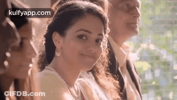 Woman Smiling Next To Man And Woman GIF